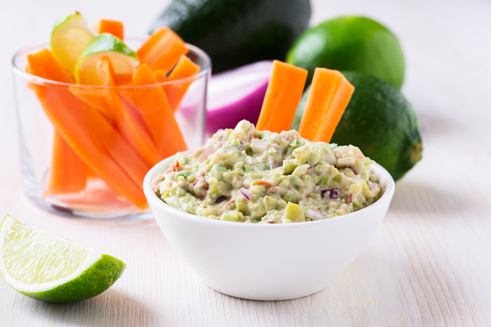 Carrot sticks dipped in a blended dip.